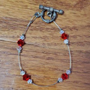 Red and clear crystal wire bracelet. Handmade. Metal clasps. Elegant